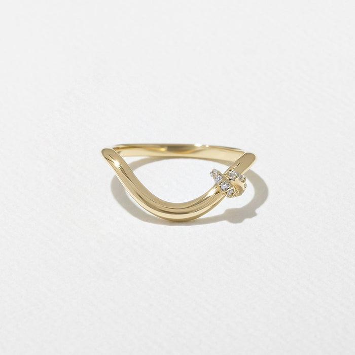 Round moissanite curved knot wedding band in yellow gold