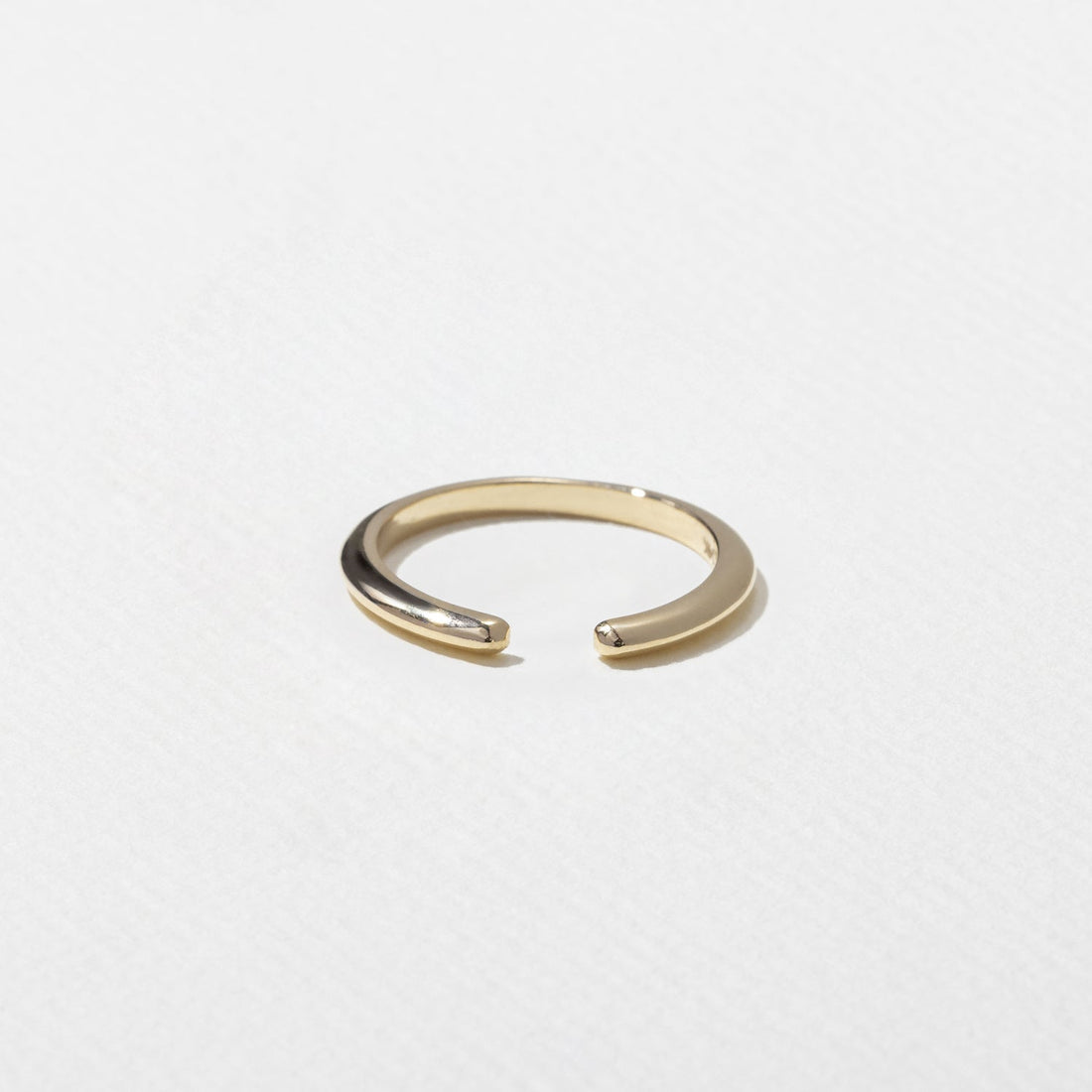 Plain open shank wedding band in yellow gold