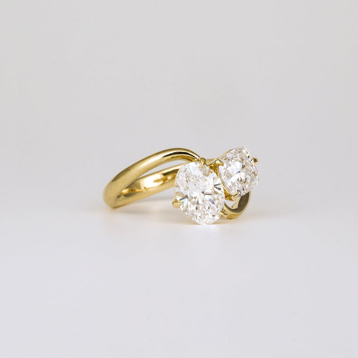 Angled view of the two oval lab grown diamonds on the crossover band