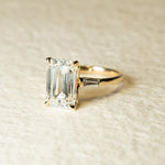 Load image into Gallery viewer, Emerald Cut Moissanite Engagement Ring – Three Stone Ring with Tapered Baguette Sides
