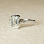 Load image into Gallery viewer, Emerald Cut Three Stone Moissanite Engagement Ring | 14K Gold Half Bezel Set Promise Ring for Women
