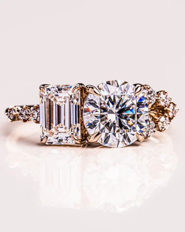 Toi Et Moi round and emerald cut moissanite engagement ring in yellow gold