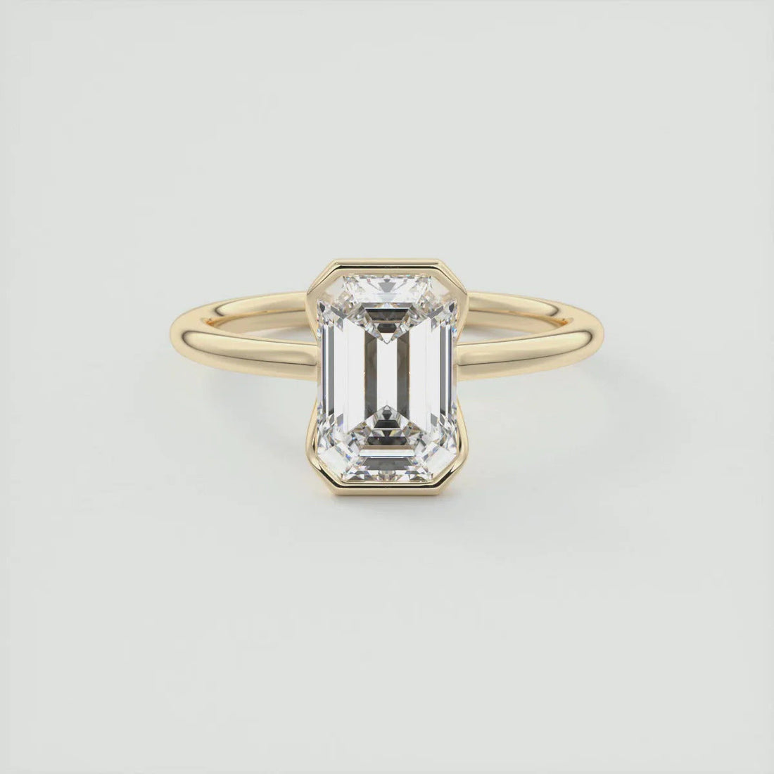 2.00 CT emerald cut moissanite half bezel engagement ring in gold
