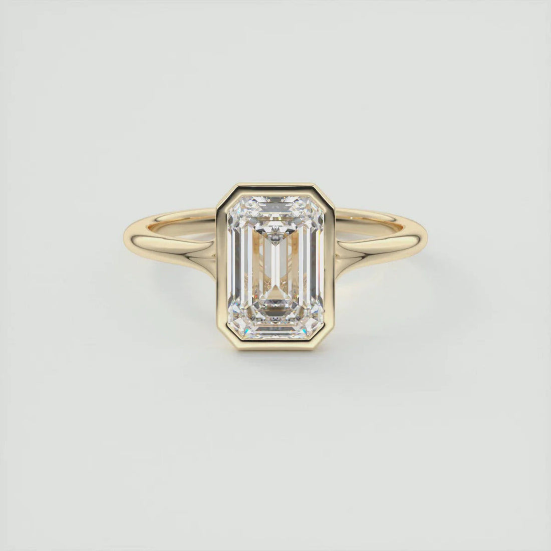 Emerald cut moissanite bezel solitaire engagement ring with split shank