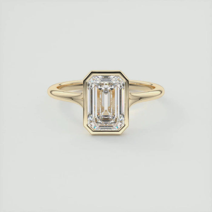 Emerald cut moissanite bezel solitaire engagement ring with split shank