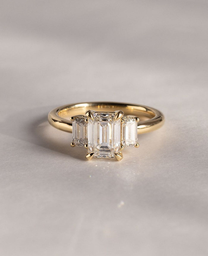 2.00 CT emerald cut moissanite three stone engagement ring in gold