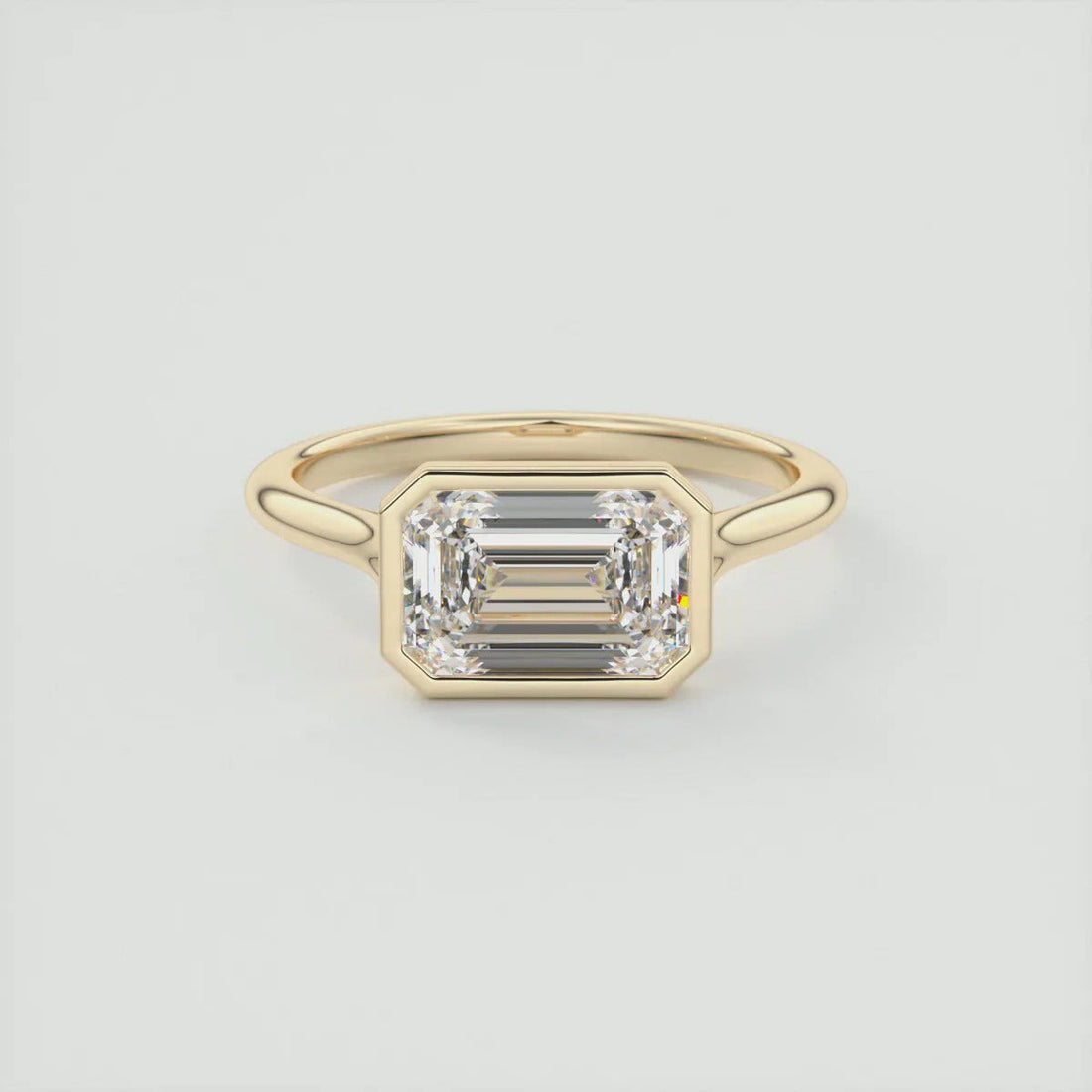 2.50 CT emerald cut moissanite east west engagement ring in gold