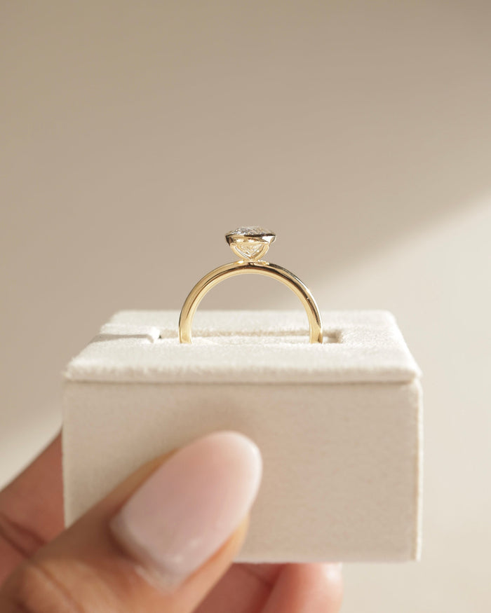 Oval Cut Moissanite Bezel Set Solitaire Engagement Ring with Polished Band - view 2
