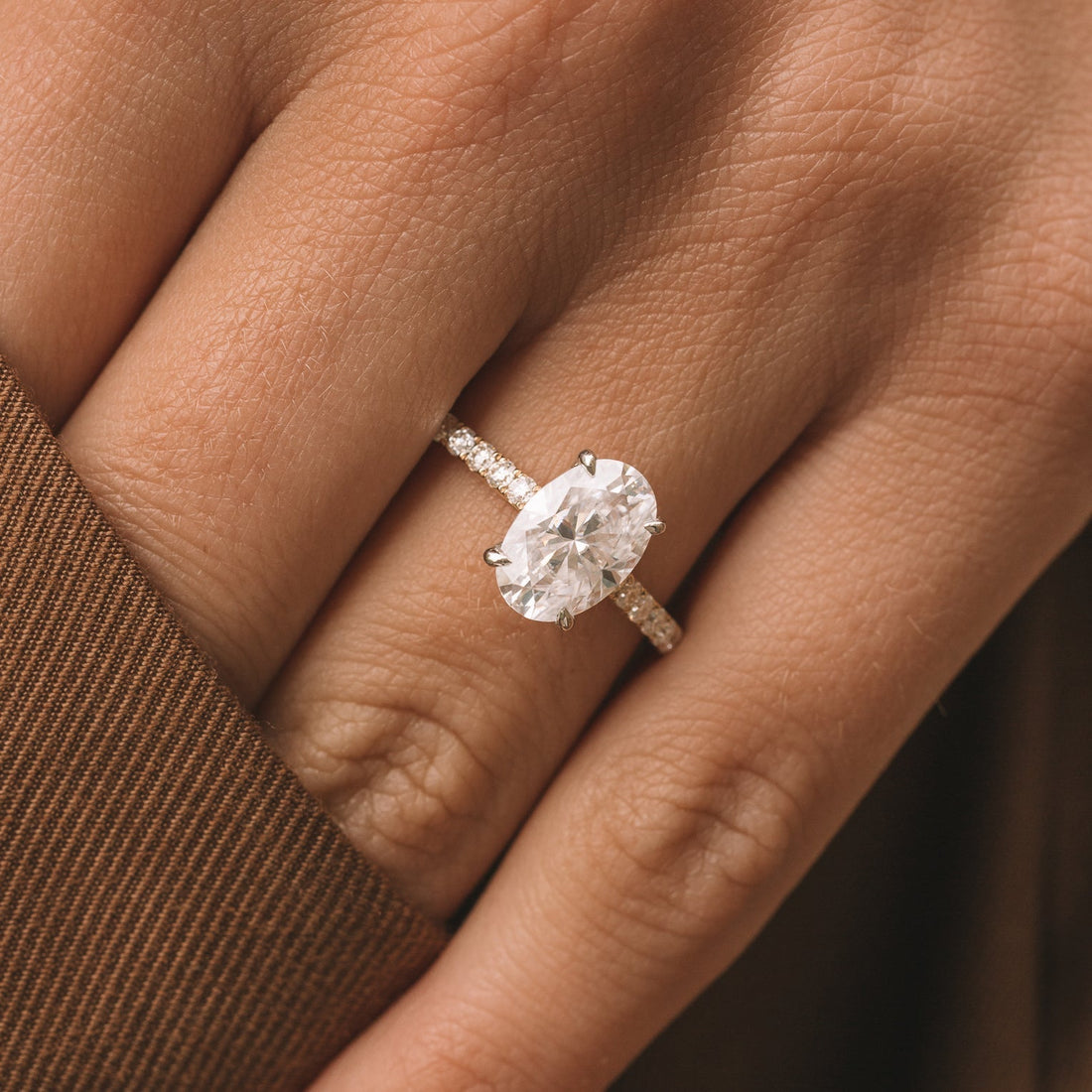 Oval Cut Moissanite Hidden Halo Engagement Ring with Four Claws and Slim Pave Band - view 1