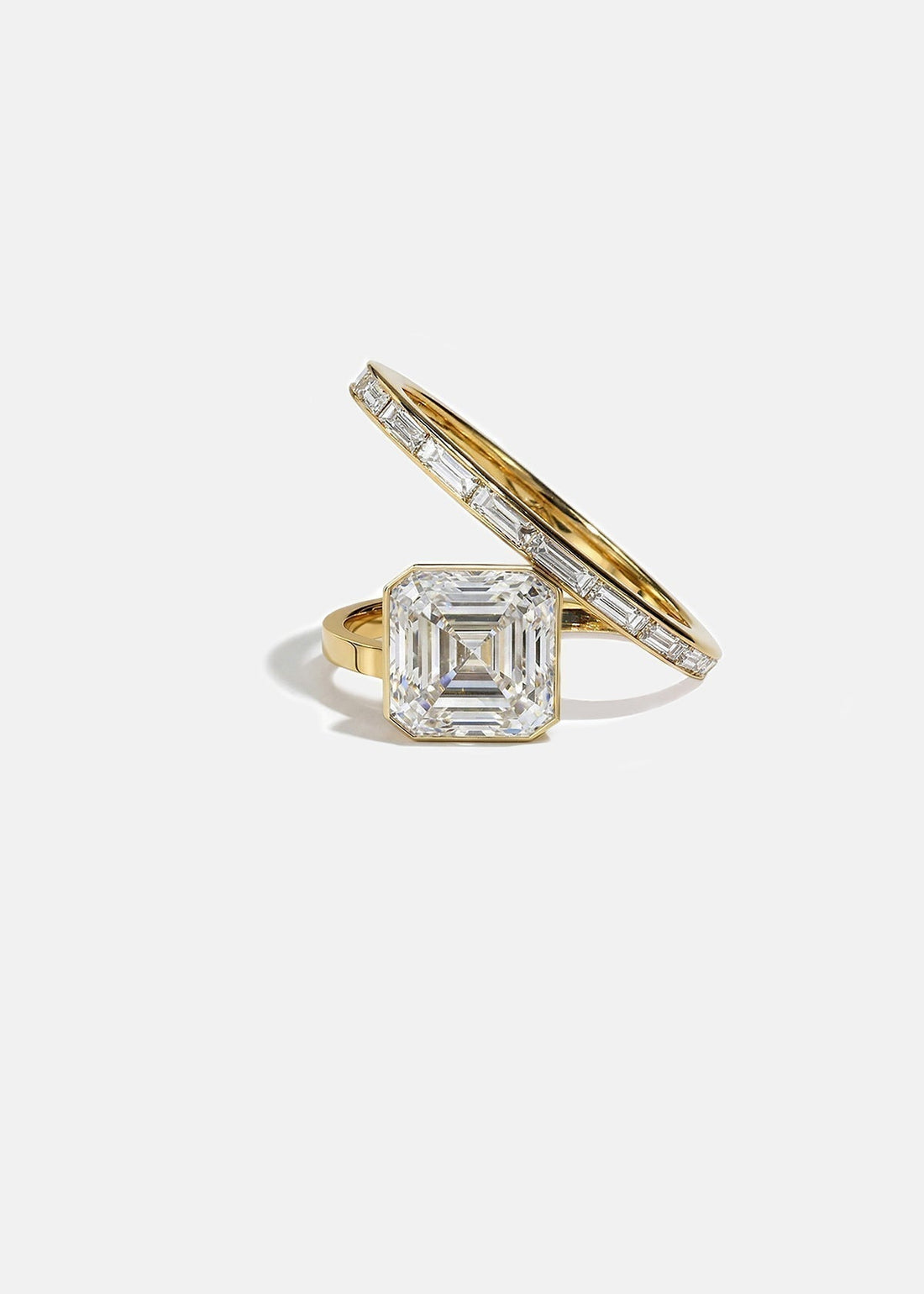 Asscher cut lab grown diamond spiral engagement ring with baguette band in yellow gold
