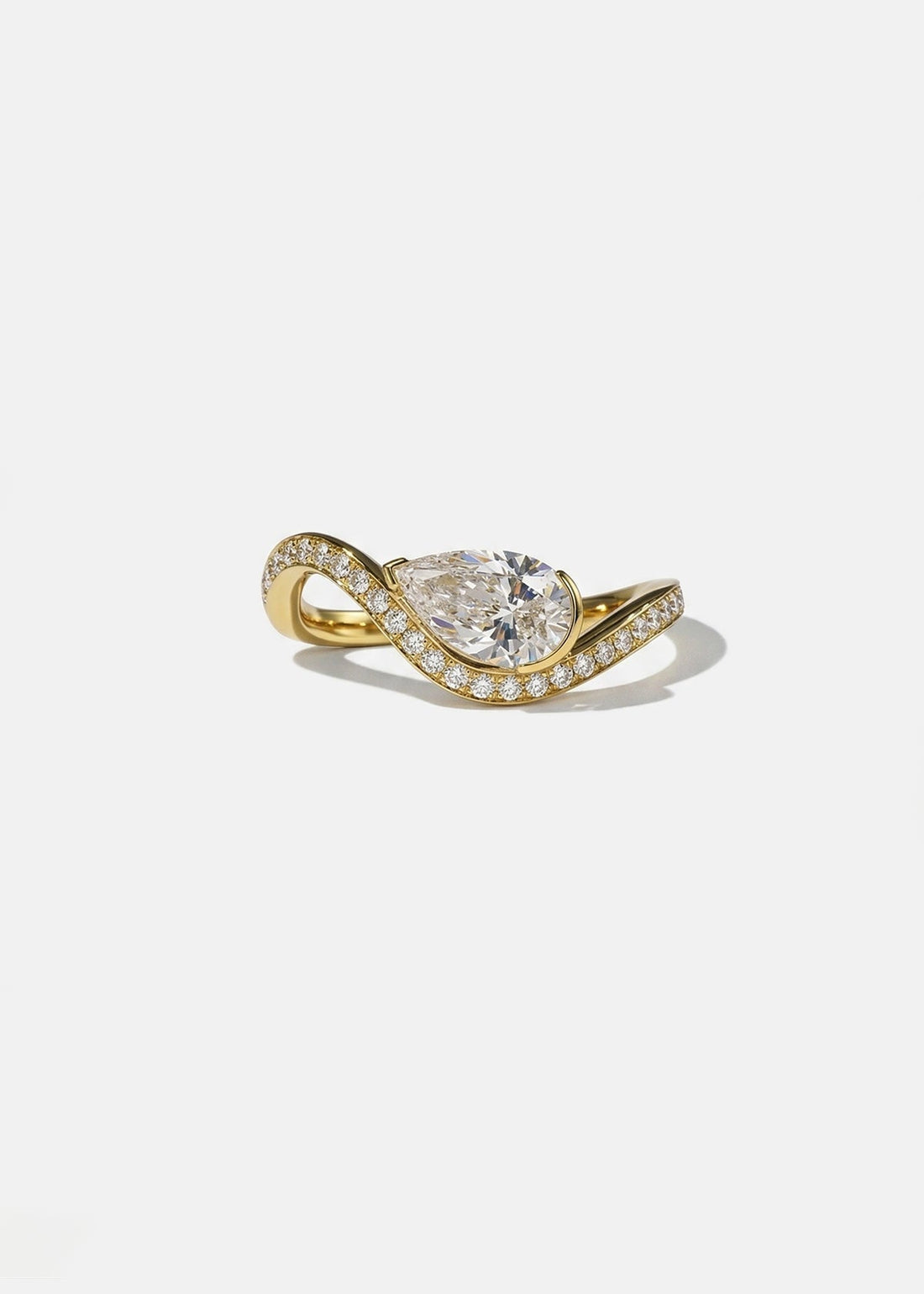 East west pear cut lab grown diamond half bezel wave engagement ring with pave in yellow gold