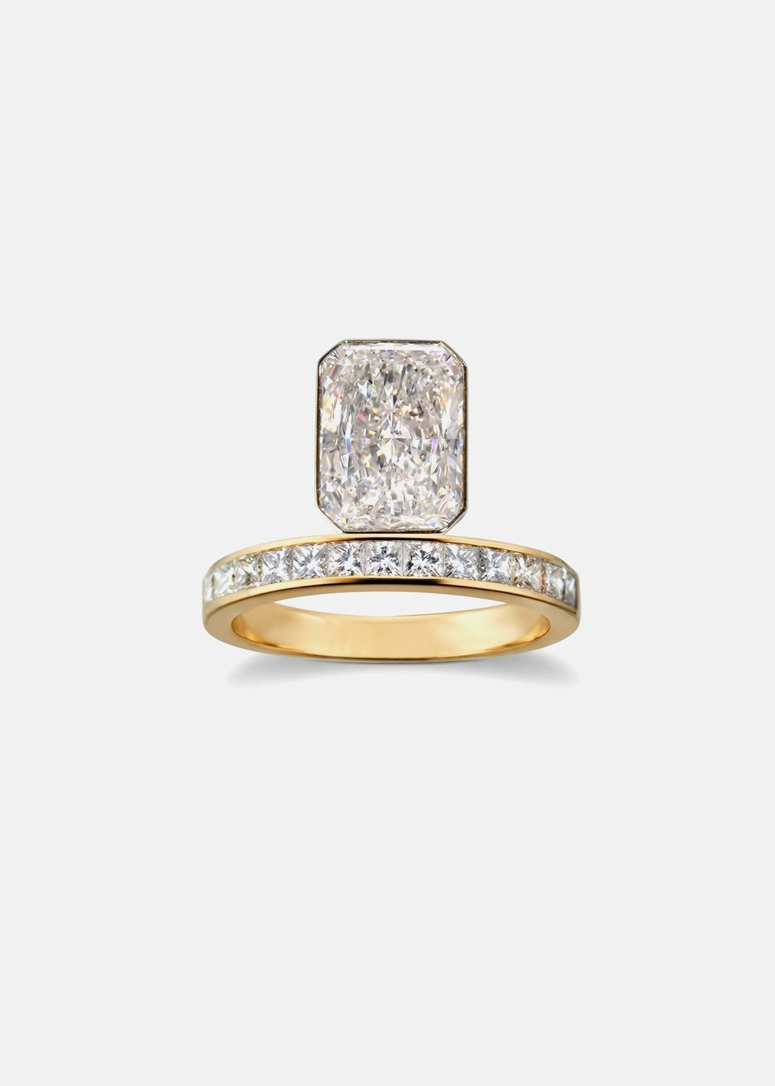 Radiant cut lab grown diamond bezel ring on a pave eternity band in yellow gold