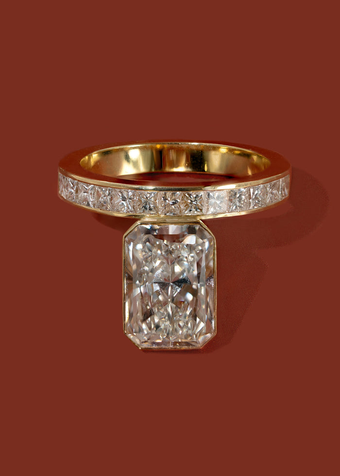 Radiant cut lab grown diamond bezel ring shown from above in yellow gold