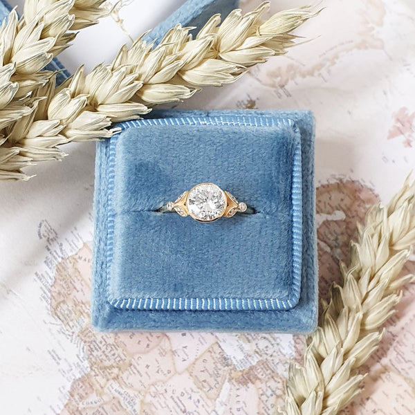 Round Cut Lab Grown Diamond Bezel Ring with Pave Leaf Shoulders in Silver, 10K, 14K and 18K Gold