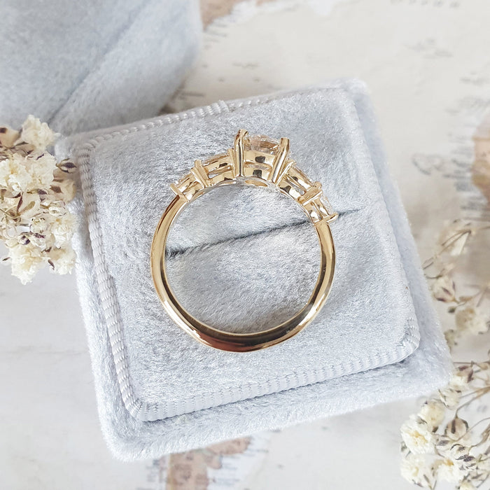 Five stone lab grown diamond engagement ring worn on the hand