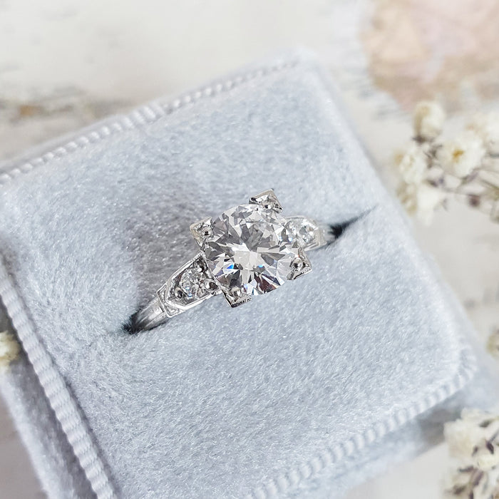 Round brilliant lab grown diamond set inside a square art deco frame