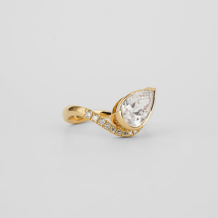 Angled view showing the twist of the pave band below the bezel