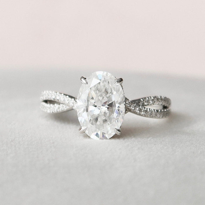Elongated oval moissanite engagement ring with hidden halo in gold