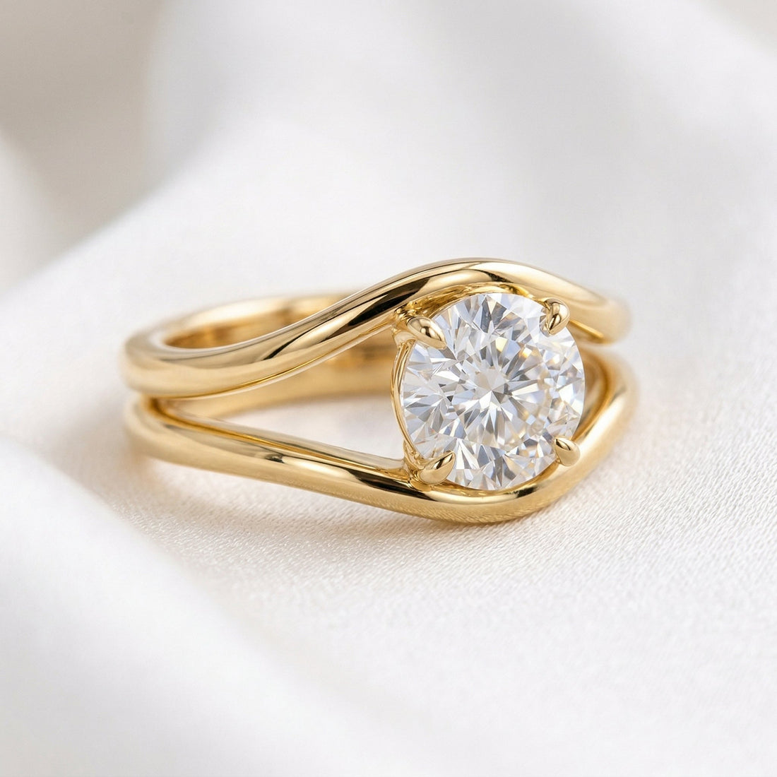 Round brilliant lab grown diamond ring held between heavy split shank arms in yellow gold