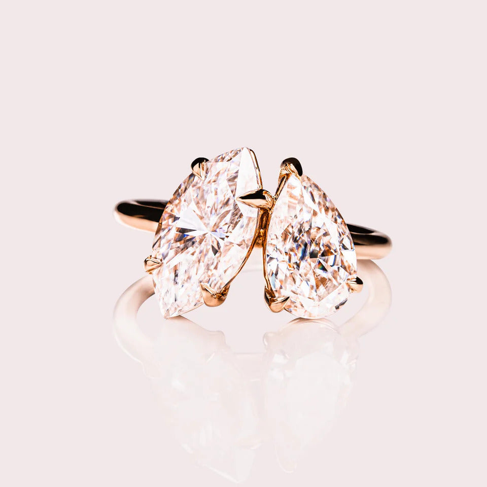 Pear and marquise cut moissanite Toi et Moi engagement ring in gold