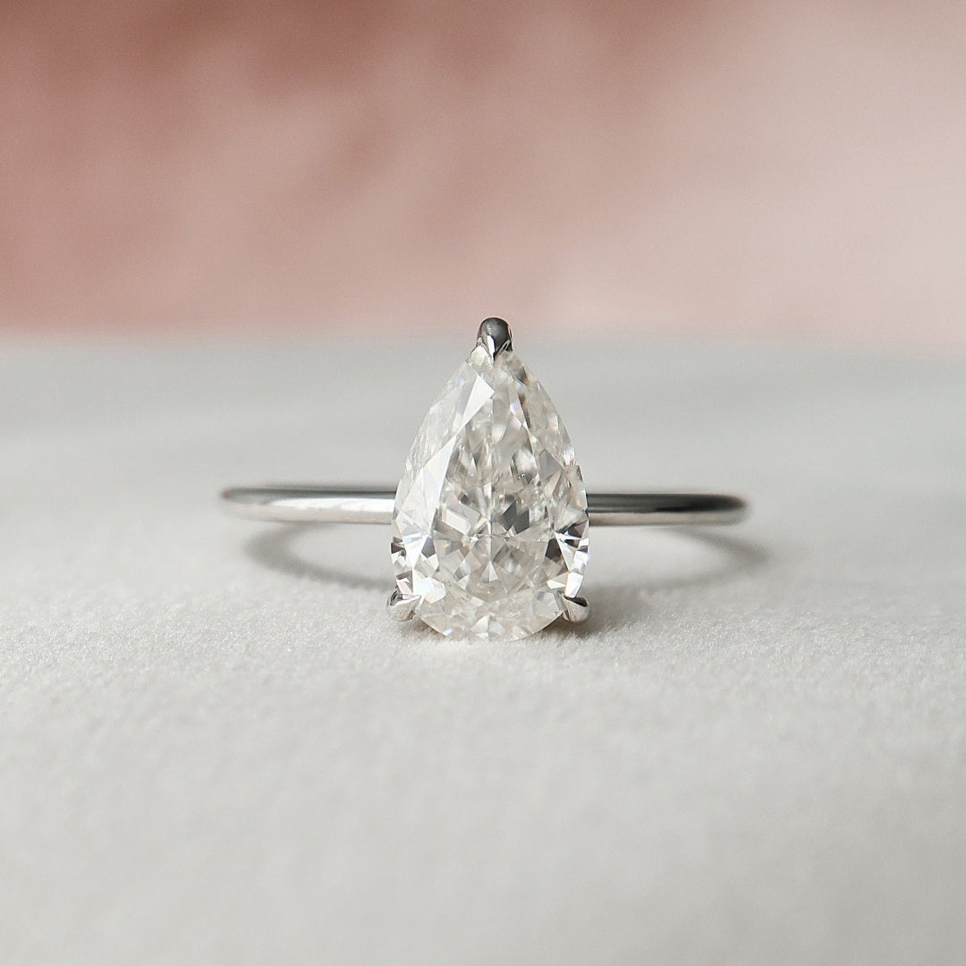 Pear cut moissanite teardrop solitaire engagement ring in gold