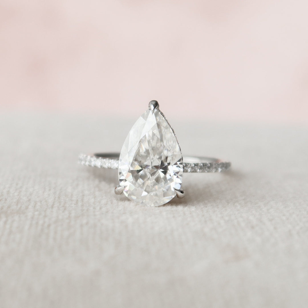 Pear cut moissanite solitaire engagement ring in 14K gold