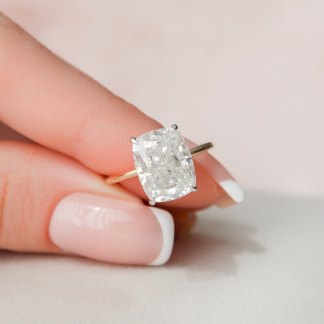 Cushion cut moissanite engagement ring in gold