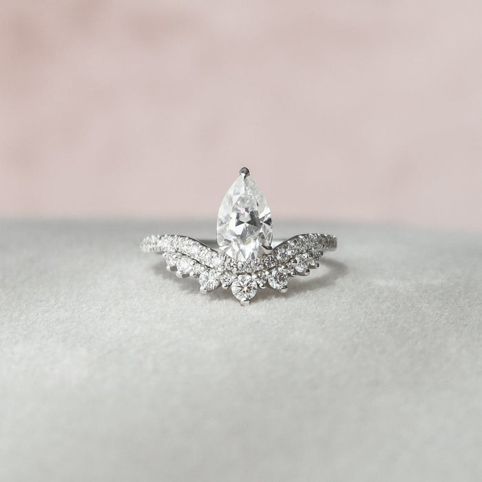 Teardrop moissanite engagement ring with stacking band in gold