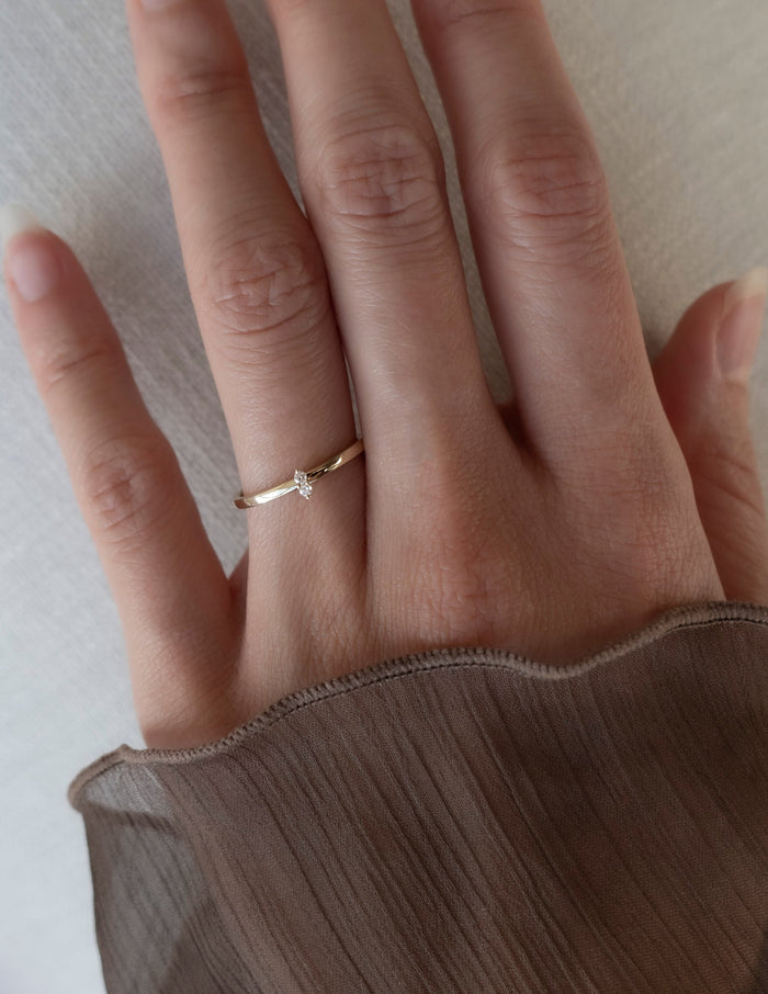 Slim duo stone moissanite stacking ring worn on the ring finger