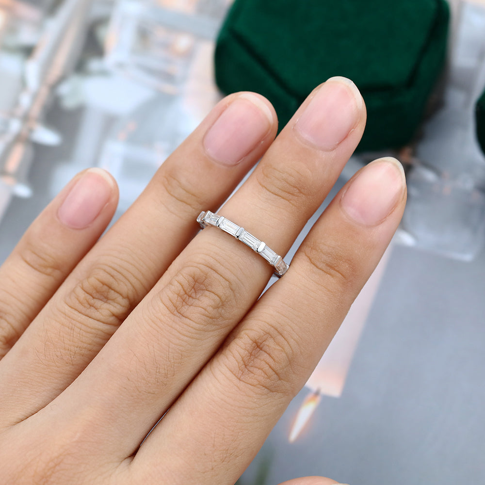 Baguette moissanite bar set full eternity wedding band worn on a finger