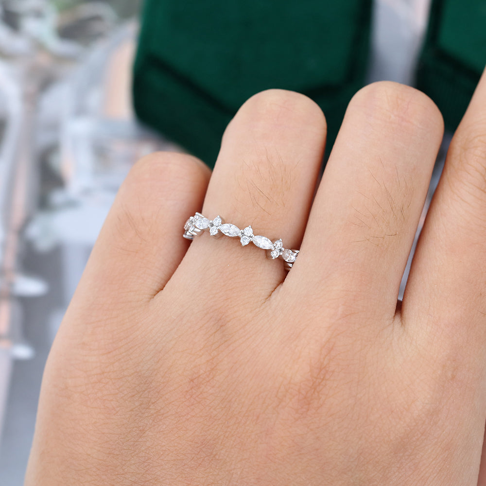 Marquise and round moissanite full eternity wedding band worn on a finger