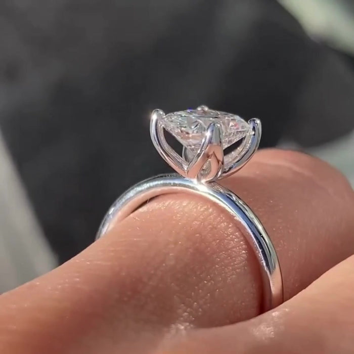 Cushion cut moissanite solitaire engagement ring in 14K gold