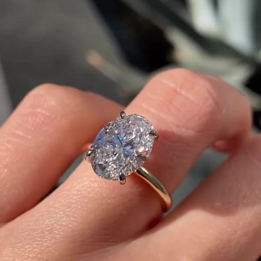 Oval cut moissanite solitaire ring in solid gold