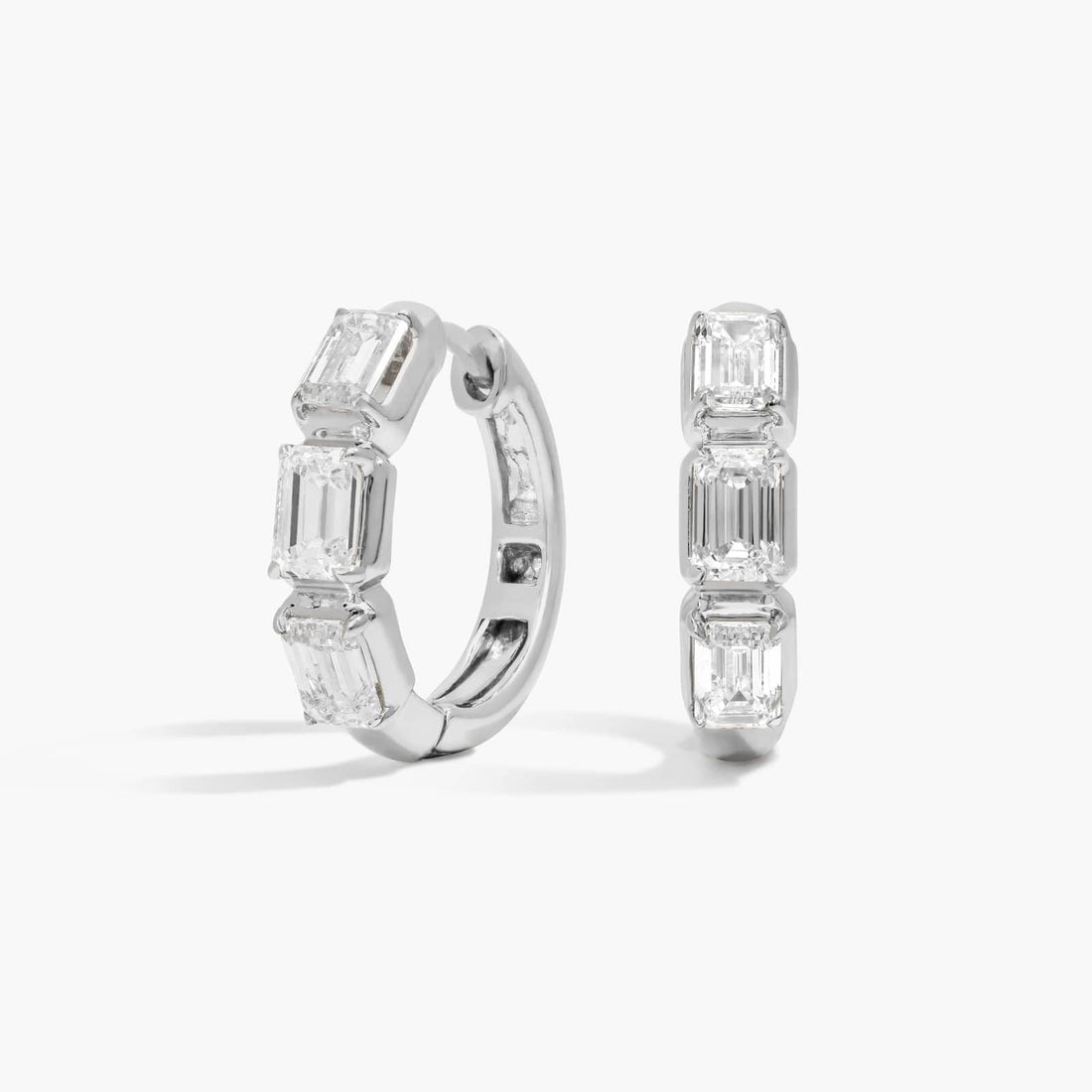 Round Cut Moissanite Graduated Pave Huggie Earrings - hero