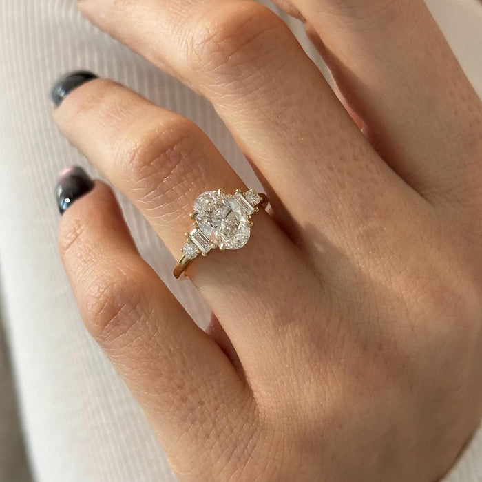 Oval cut lab grown diamond art deco ring with graduated baguette shoulder clusters