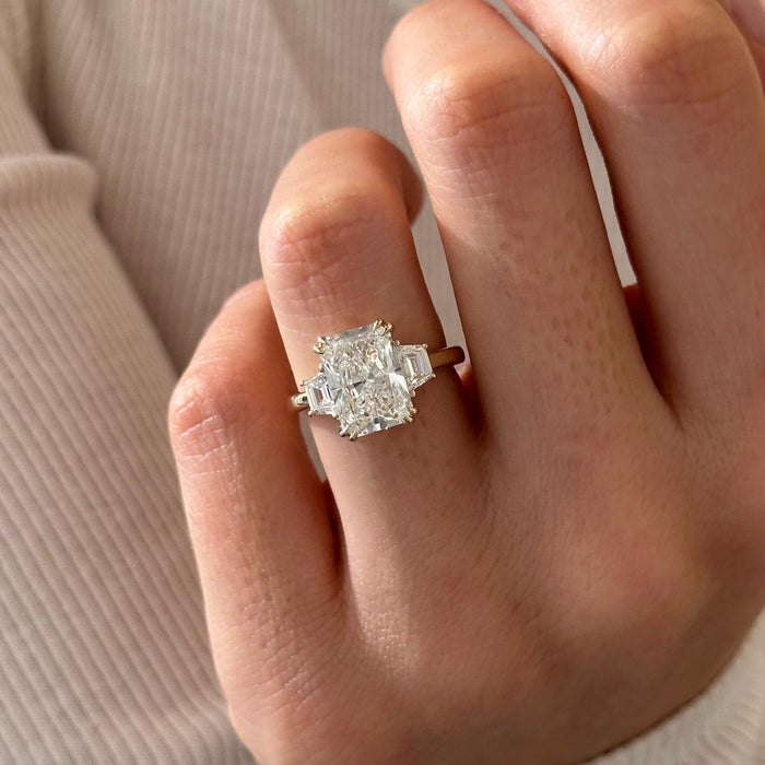 Radiant cut lab grown diamond three stone ring with trapezoid side stones