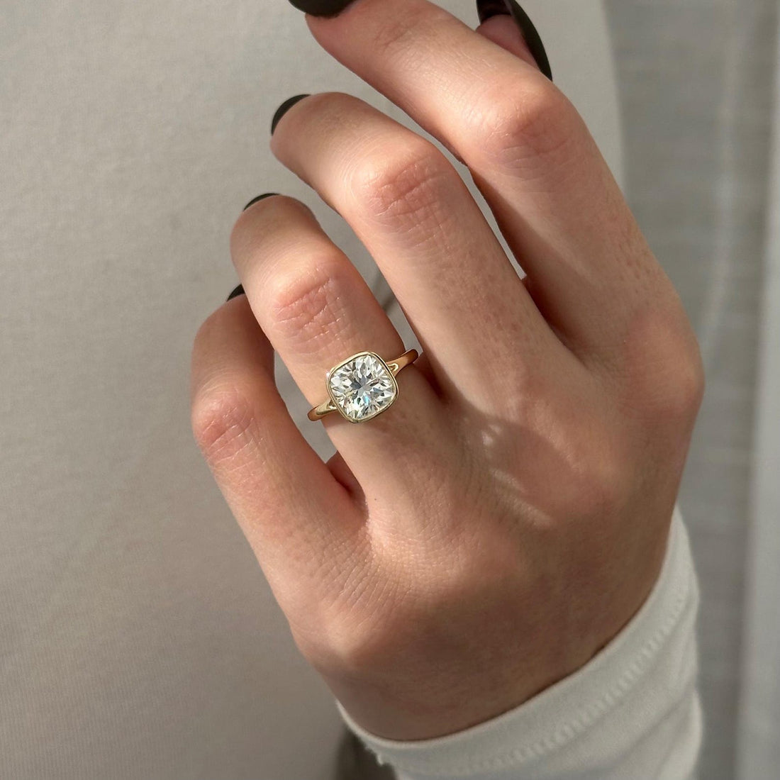 Bezel set cushion cut lab grown diamond split shank solitaire ring