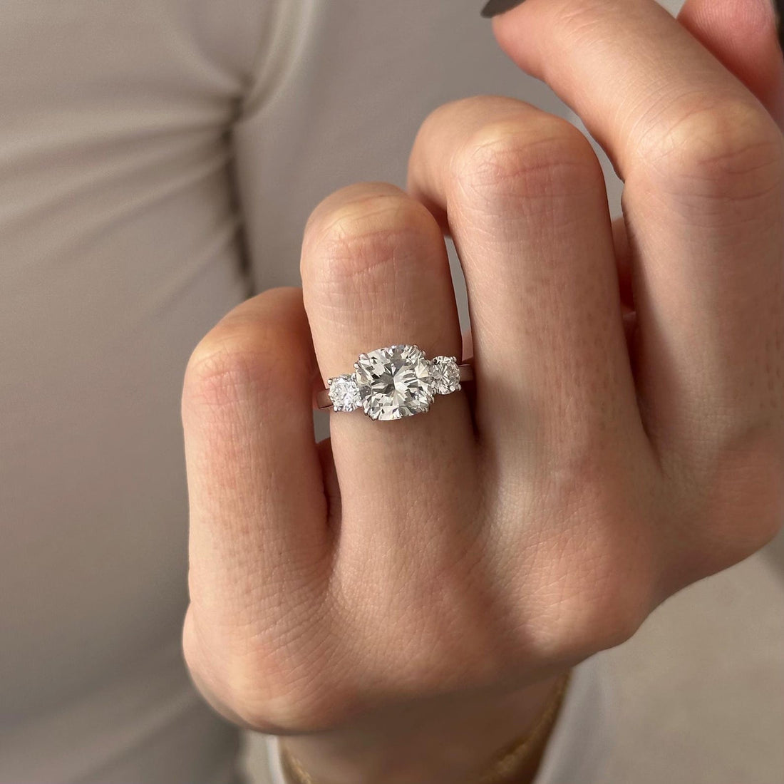 Cushion cut lab grown diamond three stone ring with half moon side stones