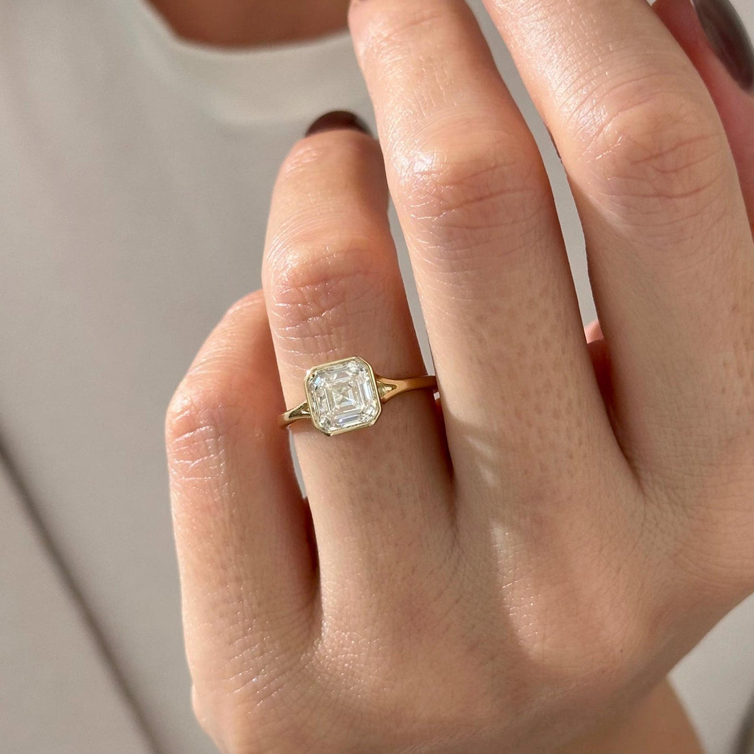 Asscher cut lab grown diamond half bezel split shank engagement ring in yellow gold