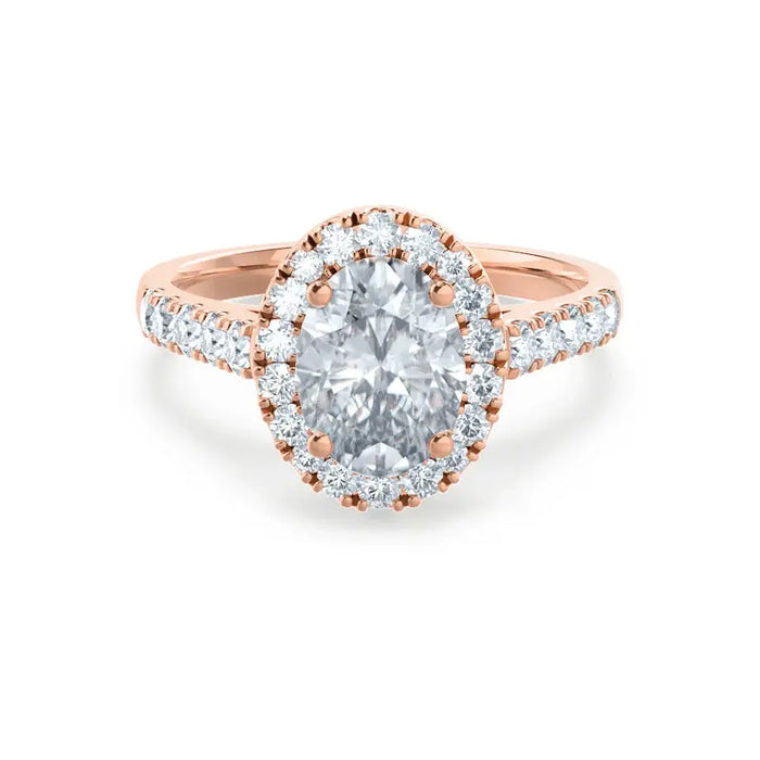 Oval cut moissanite halo engagement ring with vintage pave band in gold
