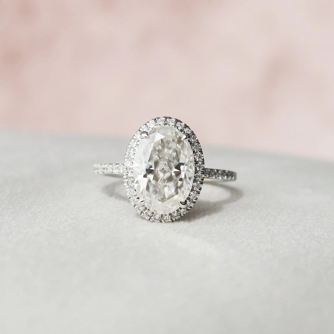 Oval cut halo moissanite engagement ring in gold
