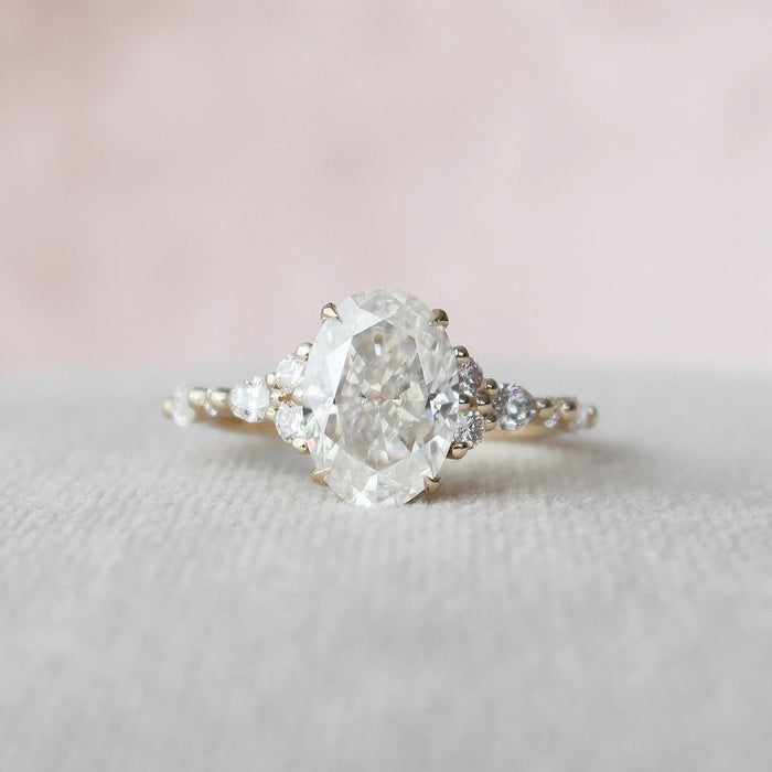 Oval cut hidden halo cluster moissanite engagement ring in gold