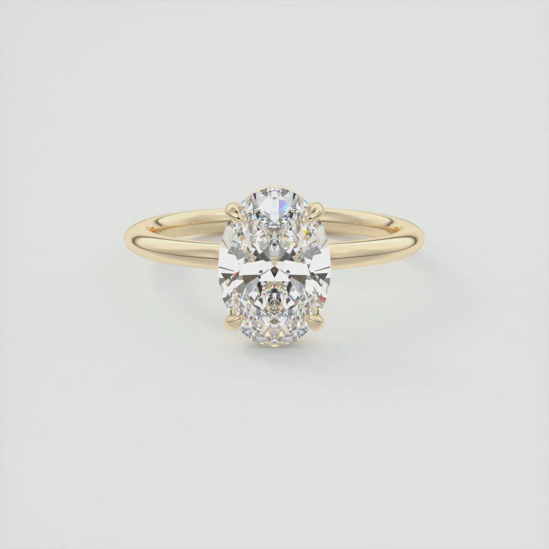 Oval cut moissanite solitaire engagement ring in 14K gold