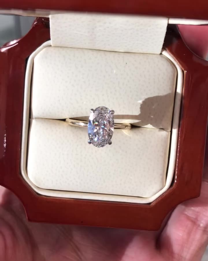Oval cut moissanite solitaire engagement ring in solid gold