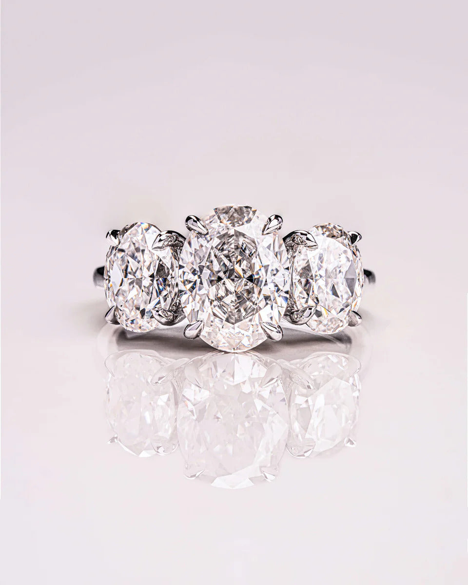 Three stone oval moissanite engagement ring in gold
