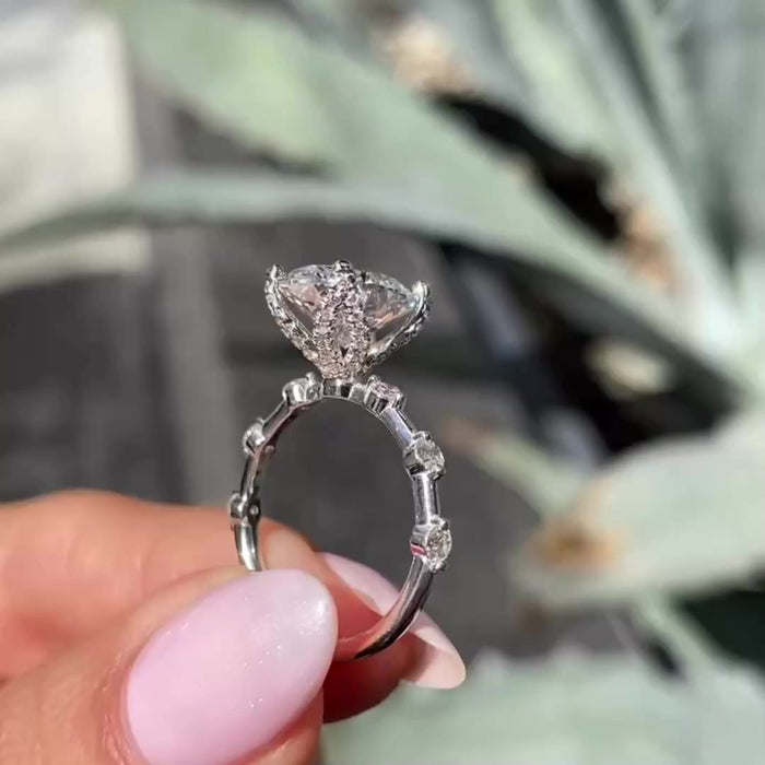 Oval cut moissanite engagement ring set in 14K yellow gold