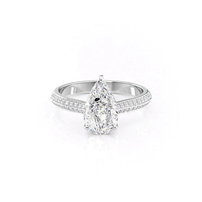 Pear cut halo moissanite engagement ring with stacking band in gold