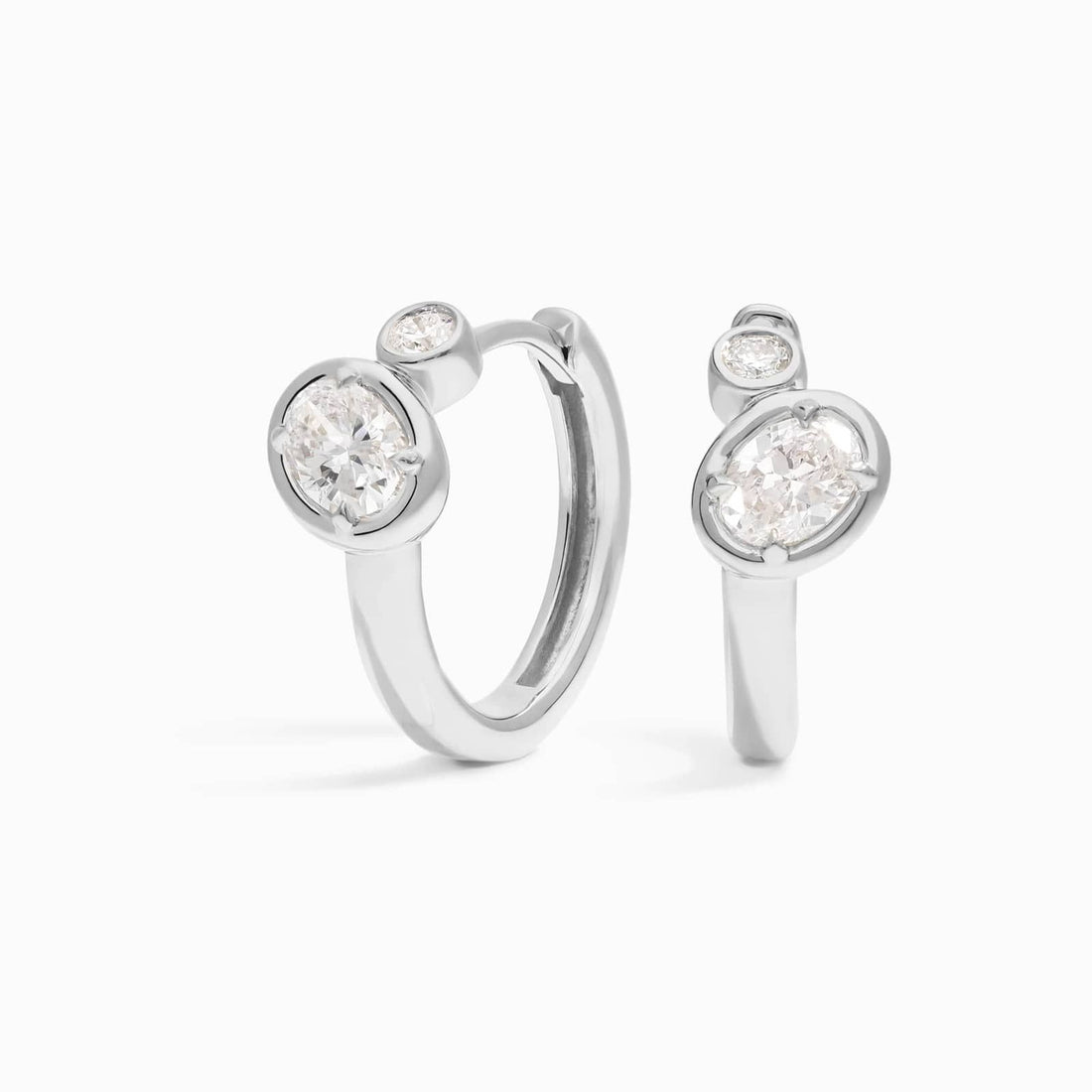 Oval Cut Moissanite Bezel Huggie Earrings - hero
