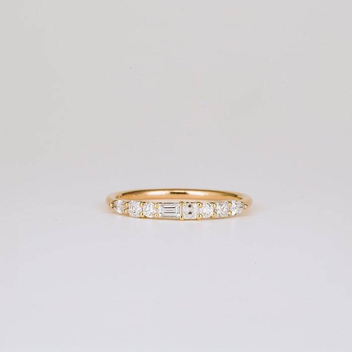 Mixed shape moissanite half eternity wedding band in yellow gold, front view