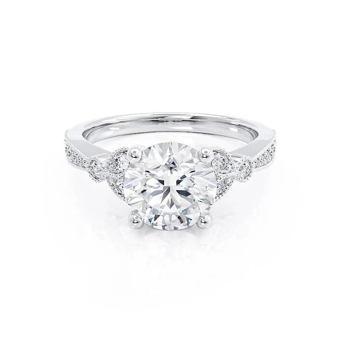 Round cut moissanite art deco engagement ring in white gold